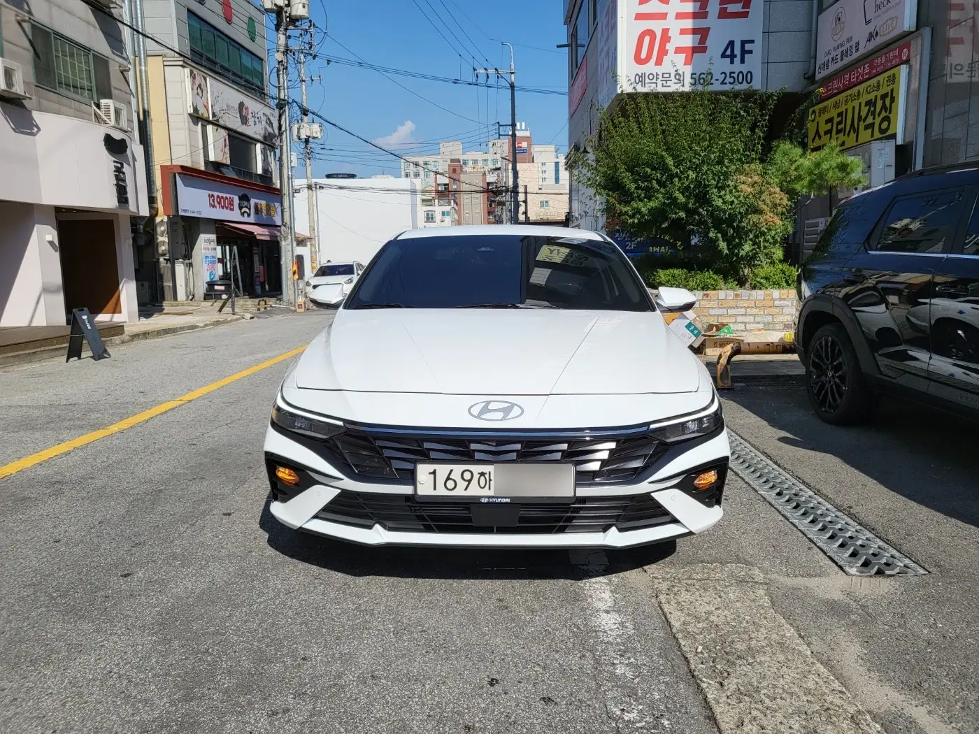땡볕에 도로에 주차 해둔 아반떼 신차장기렌트